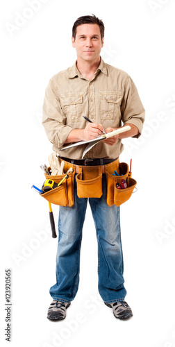 Full-length construction worker contractor carpenter with clipboard isolated on white background