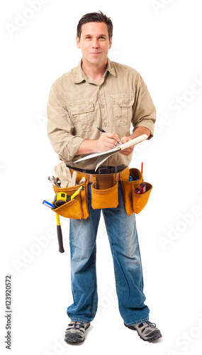 Full-length construction worker contractor carpenter with clipboard isolated on white background