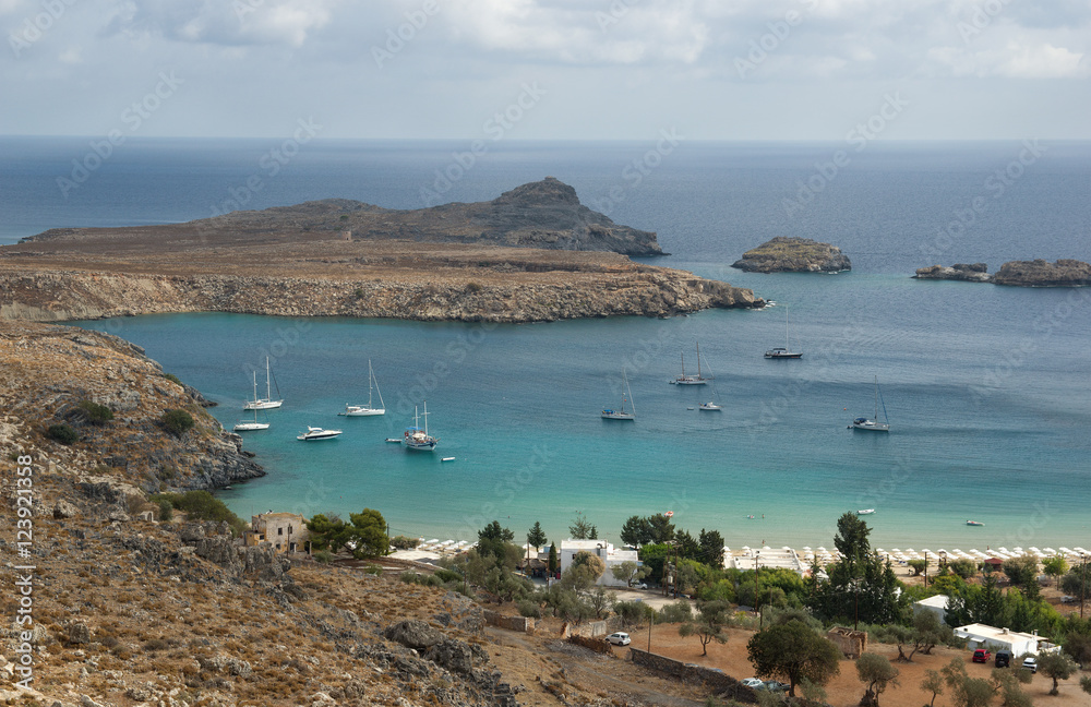 Bay of Lindos , Rhodes Island, Greece. Lindos is town on the island of Rhodes, in the Dodecanese, Greece. Above the modern town rises the acropolis of Lindos. 
