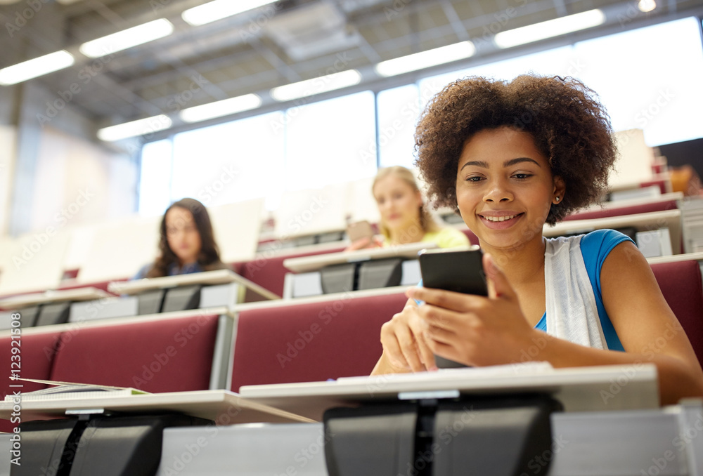 african student girl with smartphone at lecture african student girl with smartphone at lecture