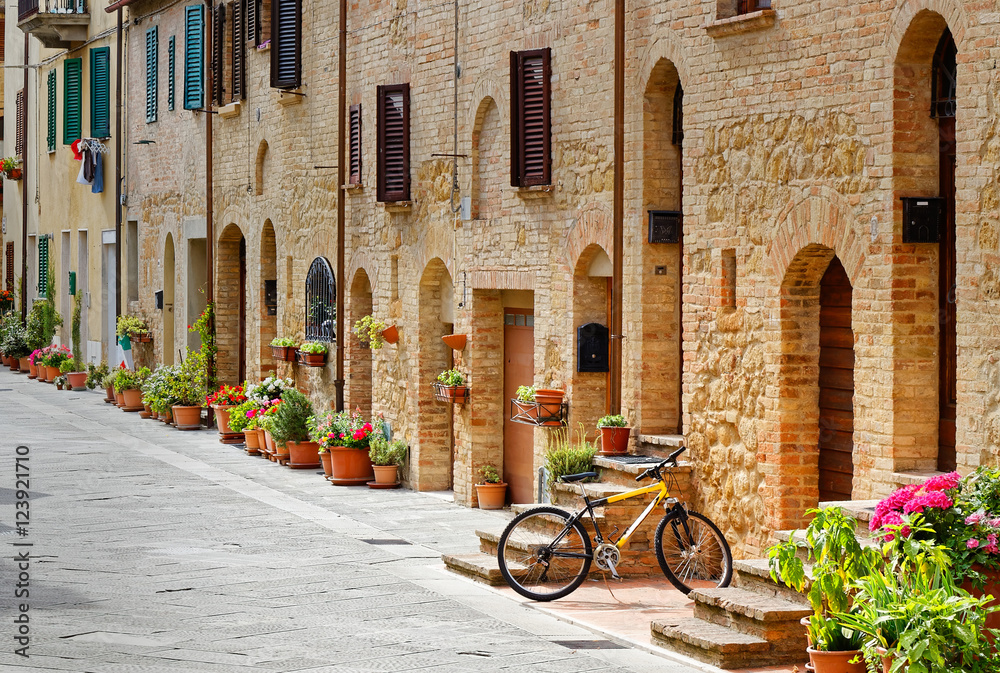Bicycle parked in an alley in Pienza (Tuscany)