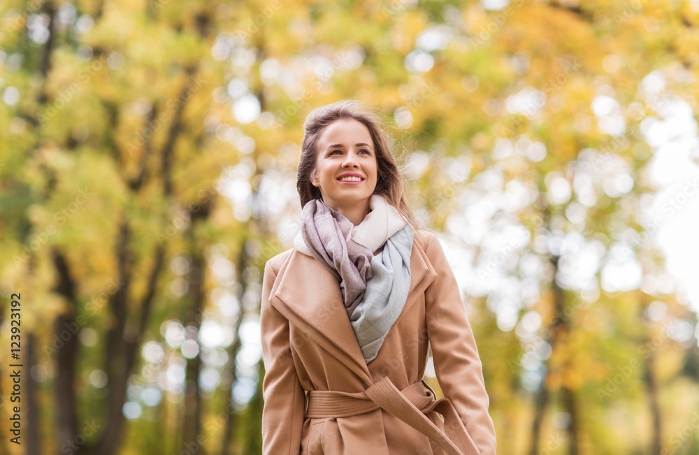 beautiful happy young woman walking in autumn park beautiful happy young woman walking in autumn park