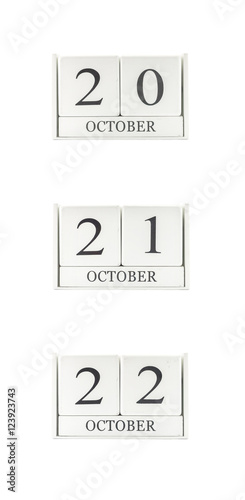 Closeup group of white wooden calendar with black 20 , 21 , 22 october word , three date calendar isolated on white background