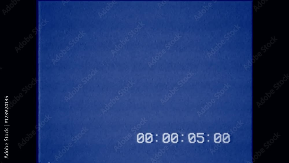 An old bad VHS tape playing. Blue screen with timecode. A vintage background for videos, a retro element.


