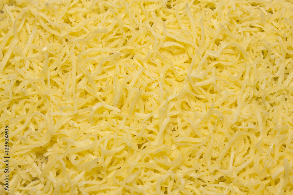 Heap of Grated pizza cheese close up texture Heap of Grated pizza cheese close up texture