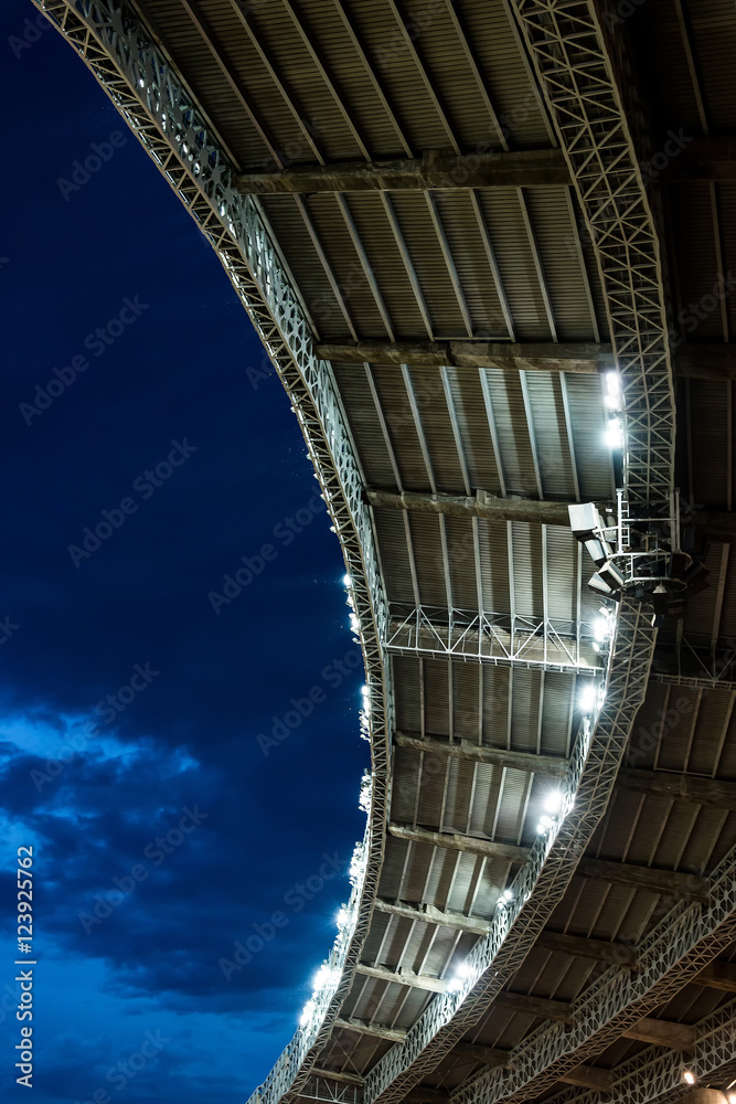 Naklejka premium stadium soccer roof at night game with copy space