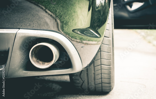 Фотография Luxury Sport car muffler on the right hand side.