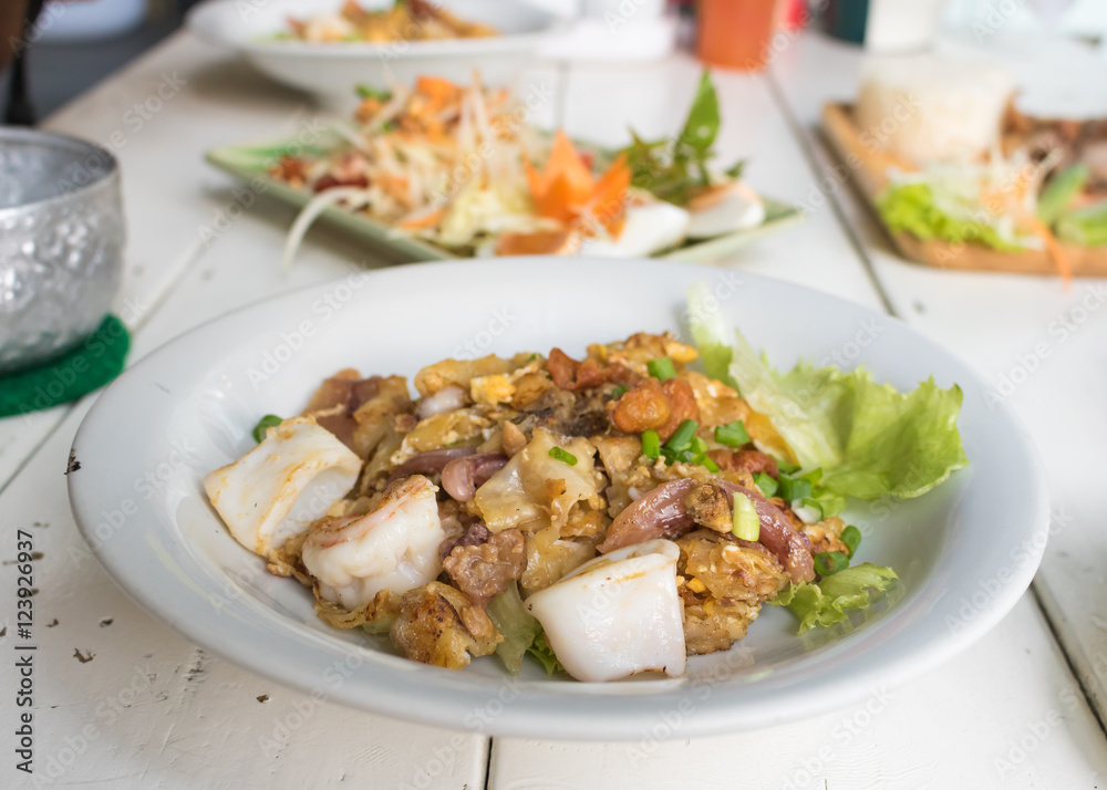 Thai food Stir fried rice noodle with chicken,squid and shrimp i Thai food Stir fried rice noodle with chicken,squid and shrimp i