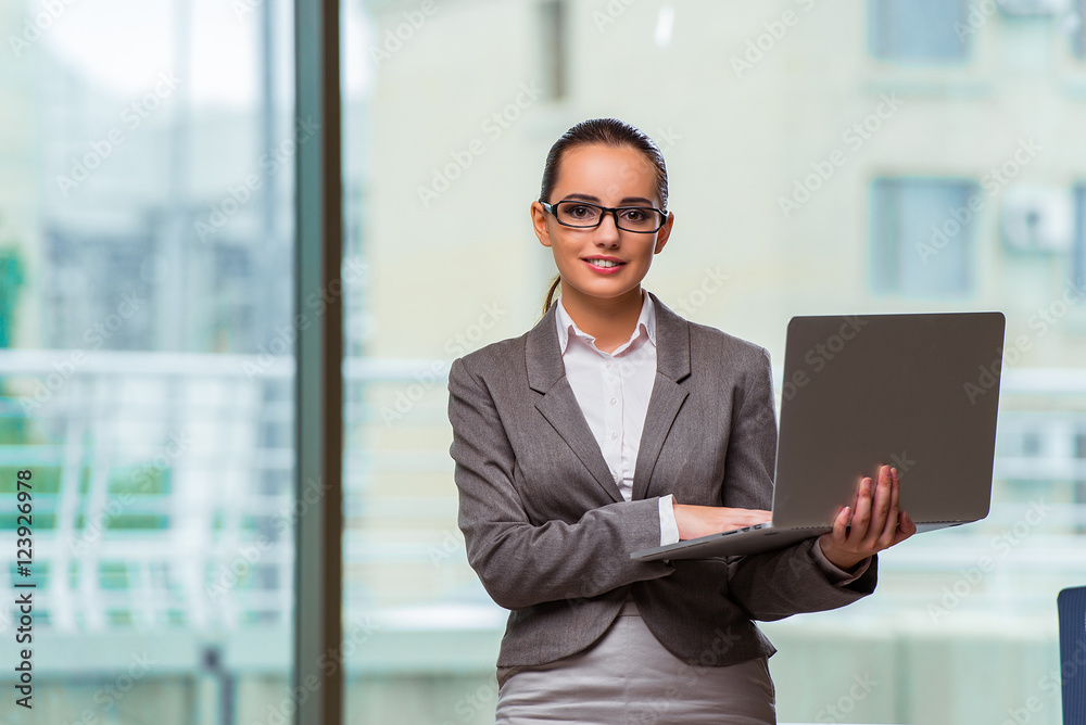 Businesswoman with laptop in business concept Businesswoman with laptop in business concept