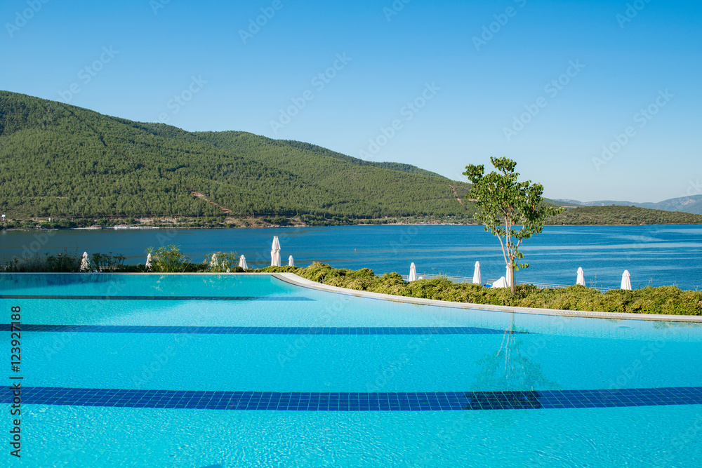 Nice swimming pool outdoors on bright summer day