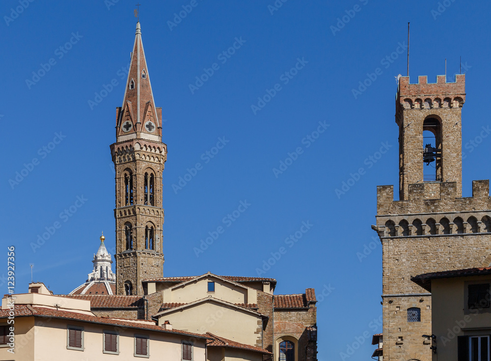 Silhouettes of Florence, two towers and roofs against the blue sky