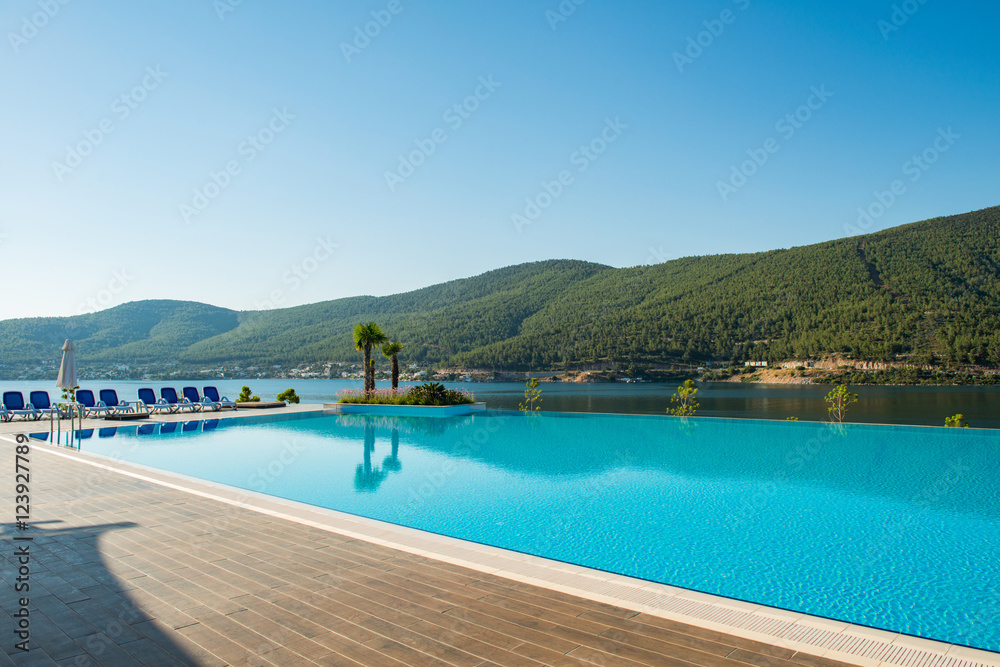 Nice swimming pool outdoors on bright summer day
