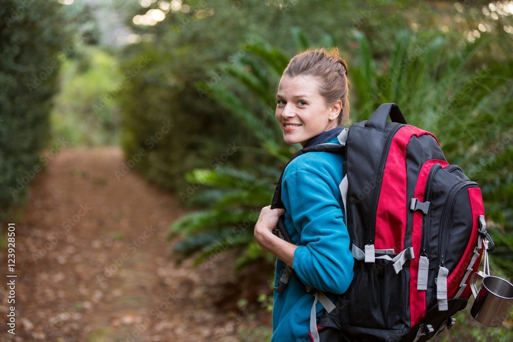 Female hiker standing in forest Female hiker standing in forest