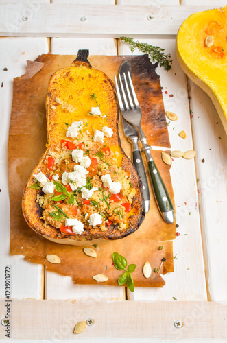 Obraz na płótnie Pumpkin stuffed with couscous, zucchini and cheese