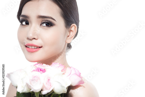 Happy bride with a bouquet of roses. Isolated on white backgroun