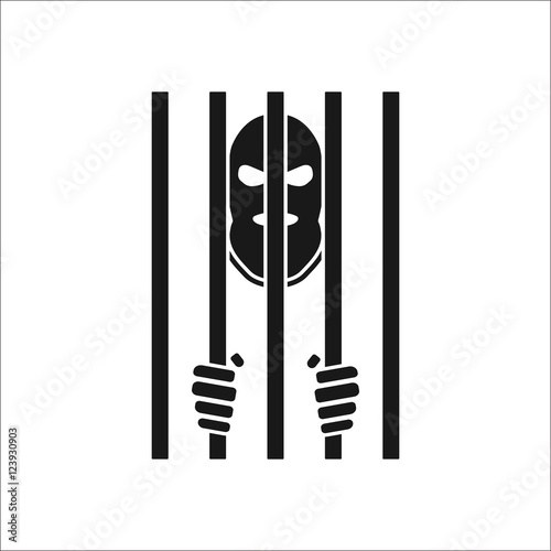 Terrorist in mask behind bars silhouette icon on background