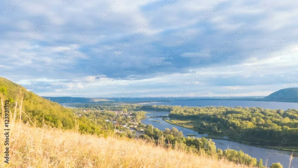 Top view of the river, islands and mountains on the horizon. The movement of clouds across the sky. Time Lapse. Top view of the river, islands and mountains on the horizon. The movement of clouds across the sky. Time Lapse.