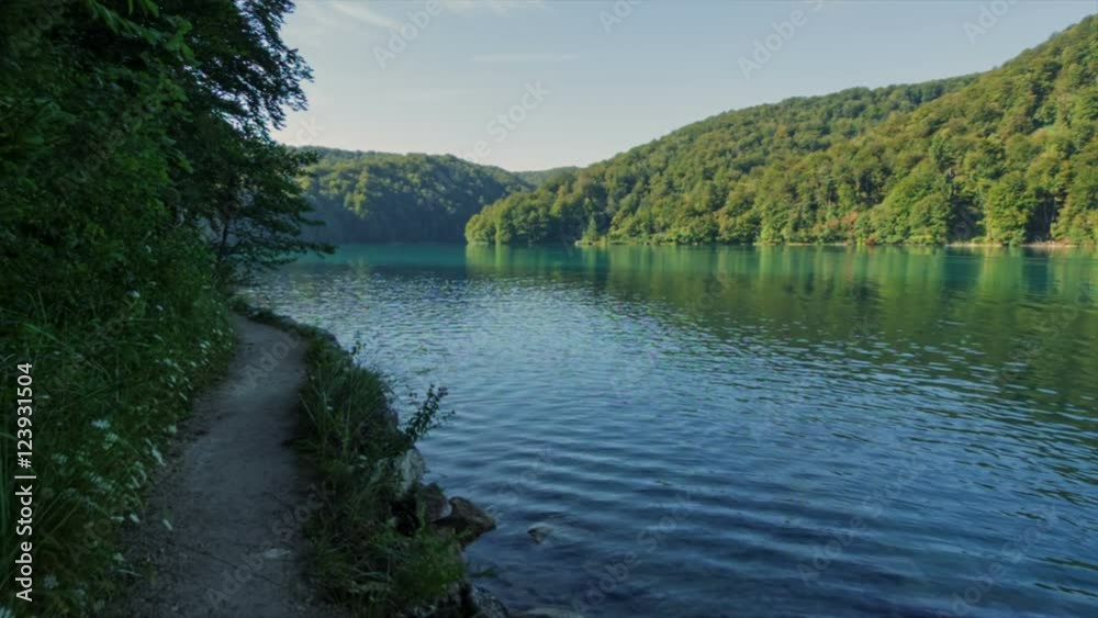Walking through mountain forest near to the lake, POV steady cam shot personal perspective. View from Plitvice lakes. Walking through mountain forest near to the lake, POV steady cam shot personal perspective. View from Plitvice lakes.