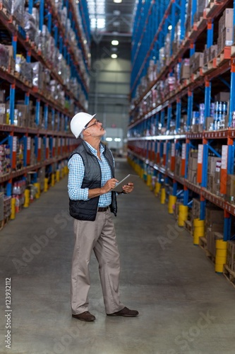 Warehouse worker using digital tablet