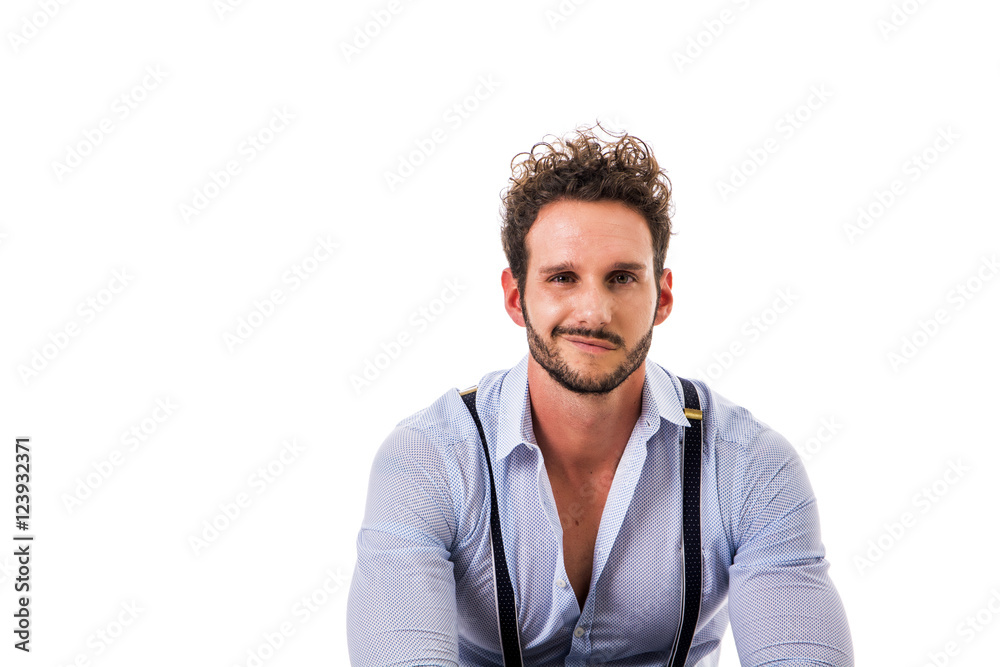 Handsome elegant young man with elegant shirt, suspenders, isolated on white, smiling and looking at camera Handsome elegant young man with elegant shirt, suspenders, isolated on white, smiling and looking at camera