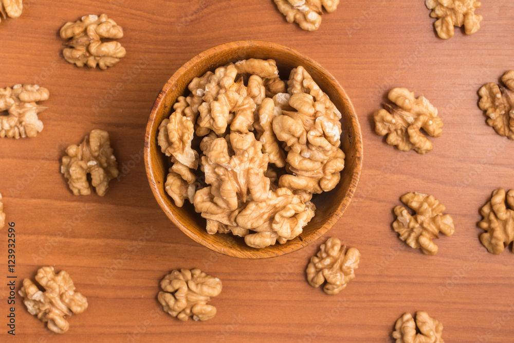 Walnuts into a bowl Walnuts into a bowl
