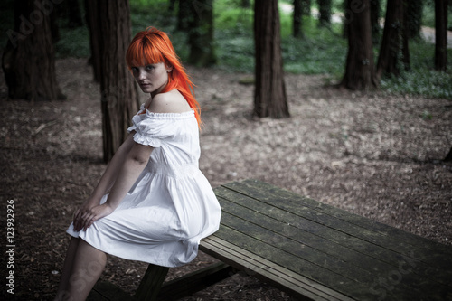 Woman in white dress in the woods