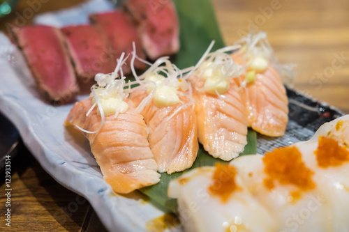 Toro salmon or fatty salmon sushi, background concept