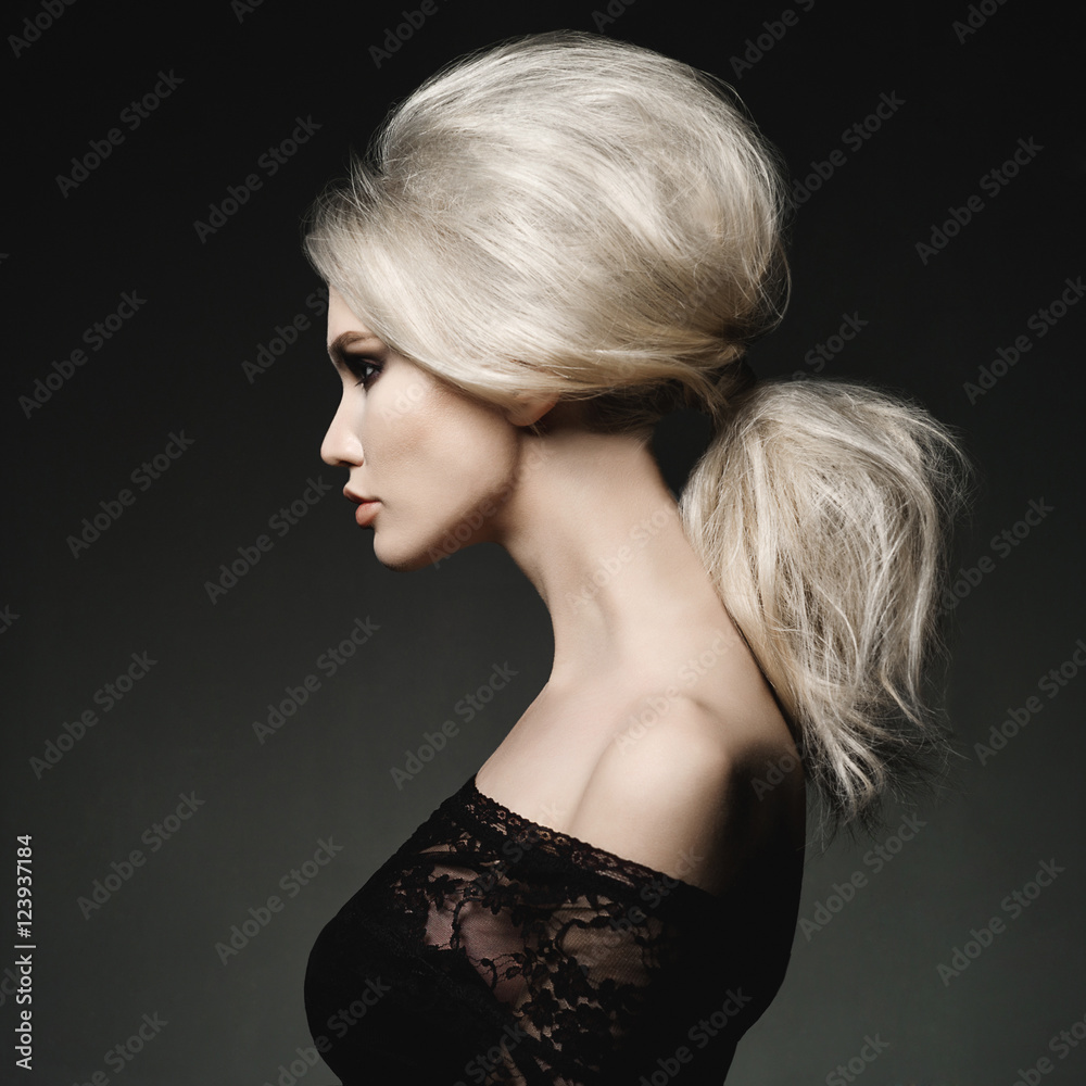 Fototapeta premium Beautiful blonde woman with elegant hairstyle