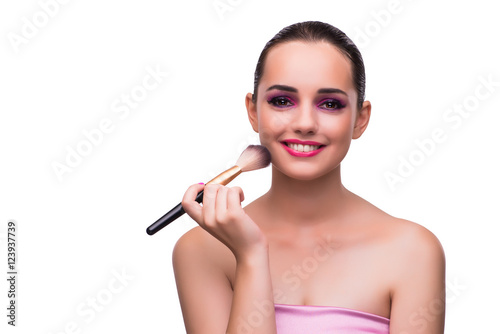 Woman getting make-up isolated on white