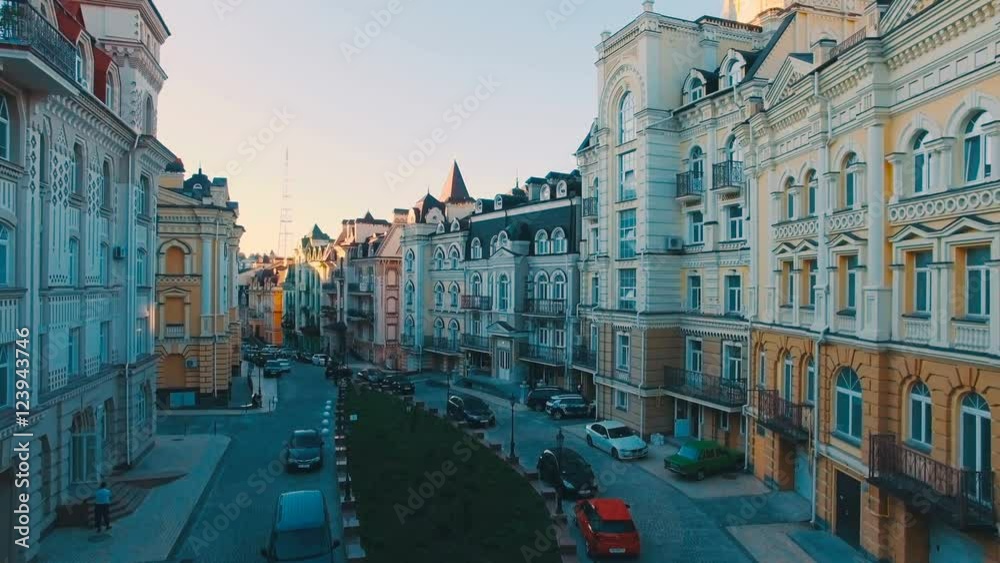 Aerial View of Buildings on the Old Narrow European Streets with Colorful Houses and Pedestrians at Sunset, Shot in 4K UHD