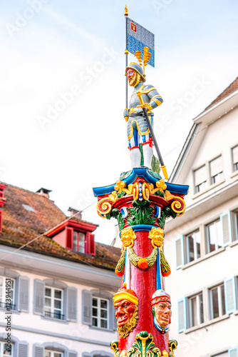 Colorful old fountain statue on the Kapell square in the old town of Lucerne city in Switzerland