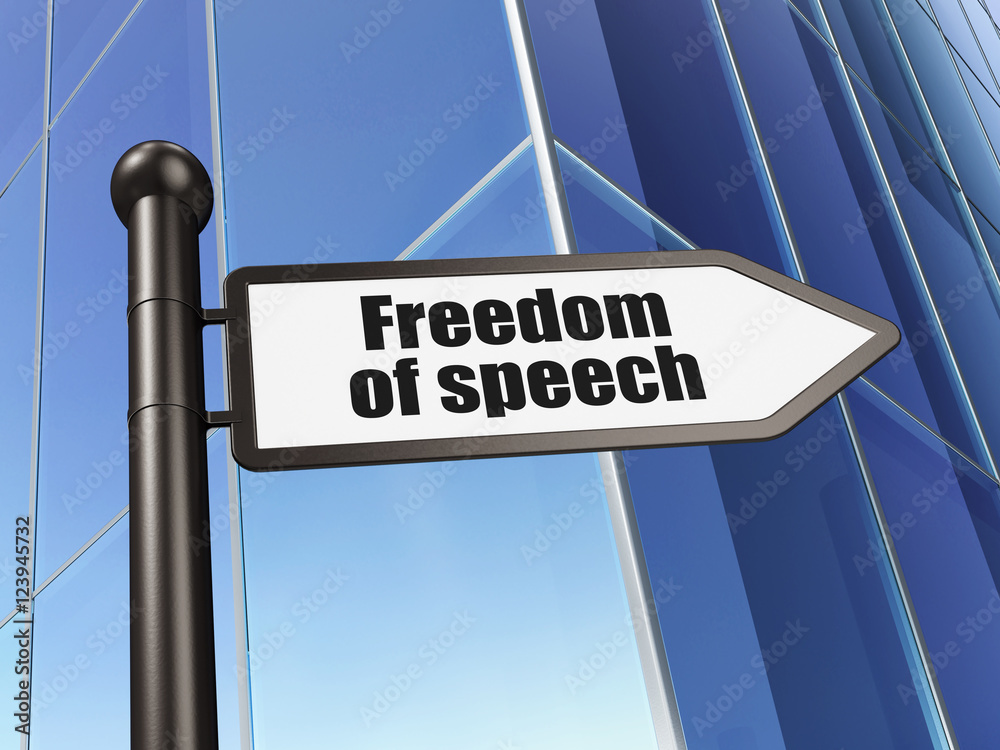 Political concept: sign Freedom Of Speech on Building background