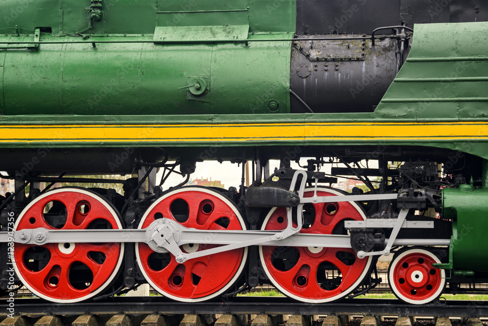 Front locomotive view. Close-up shoot of big loco wheels Front locomotive view. Close-up shoot of big loco wheels