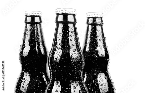 Obraz na płótnie three glass black bottles of beer, isolated on white background w salonie