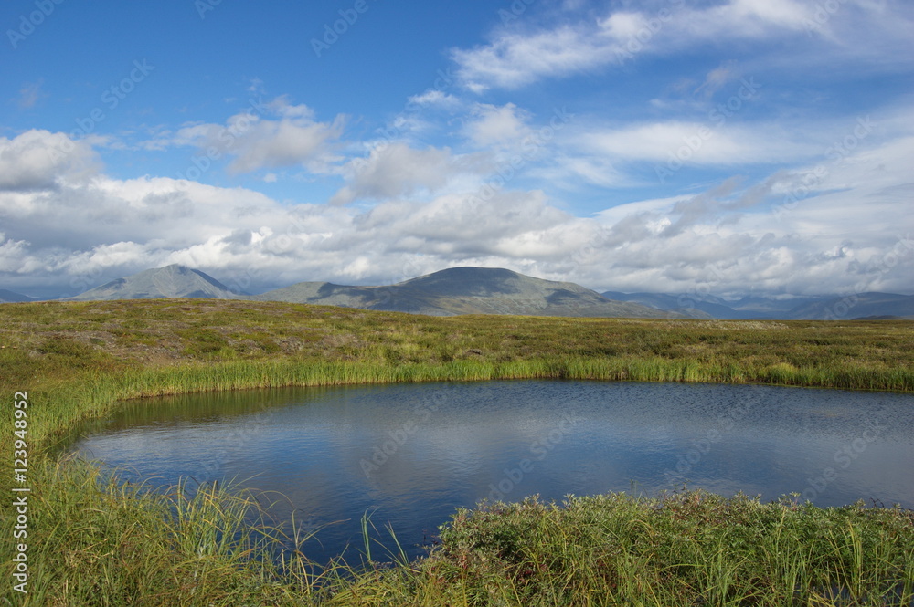 Nice lake in the mountain tundra. Journey through the Polar Urals. Nice lake in the mountain tundra. Journey through the Polar Urals.