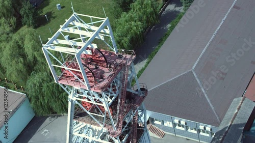 Rotating sheave wheels of mine hoist, shaft lifting system