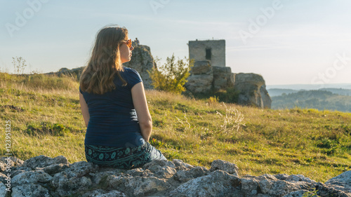 Pregnant Woman Rest in Sunset in Montains