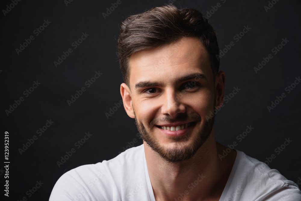 handsome bearded businessman against black background handsome bearded businessman against black background