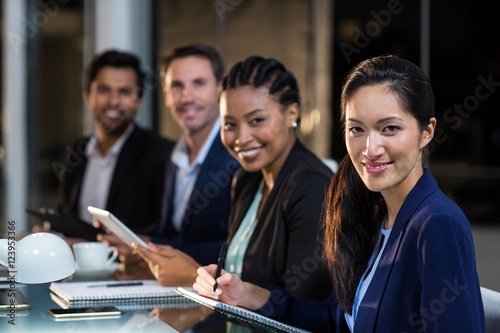Group of businesspeople sitting in a meeting