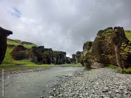 Mossy canyon stream Fjadrargljufur in Iceland