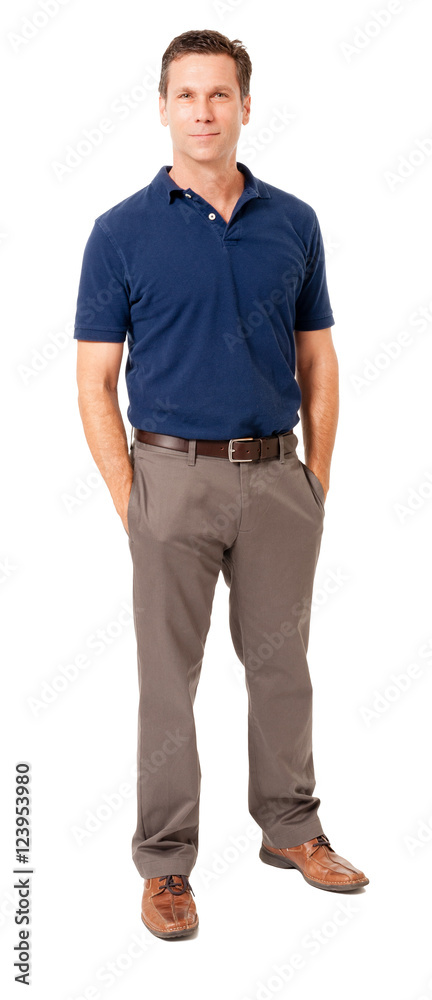 Full-length causal businessman in polo shirt with hands in pockets isolated on white background Full-length causal businessman in polo shirt with hands in pockets isolated on white background
