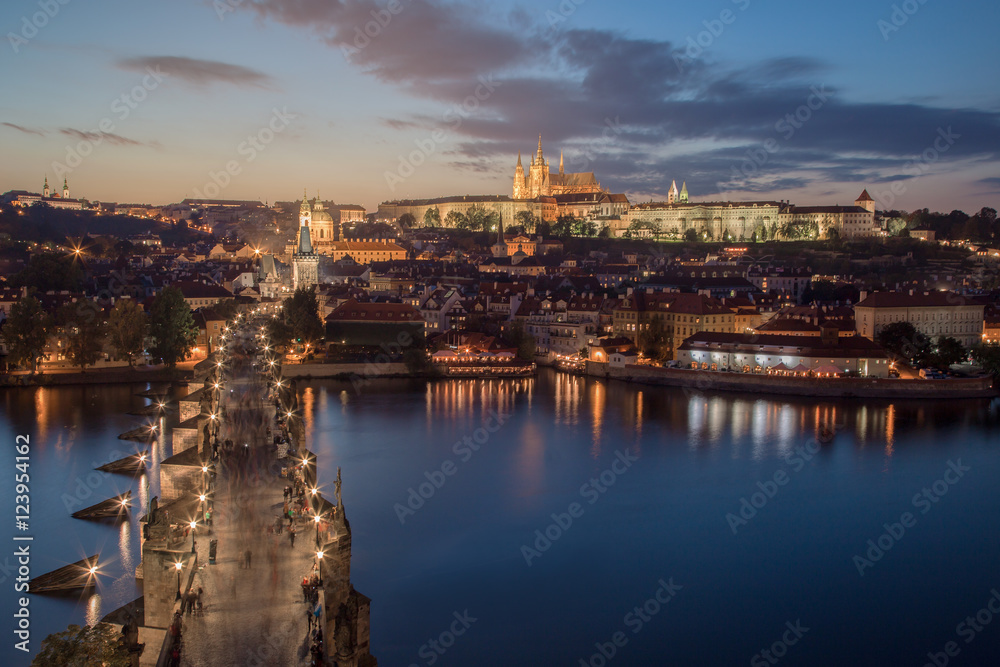 Panorama of Prague with red roofs from above autumnal day at sunset, Czech Republic.