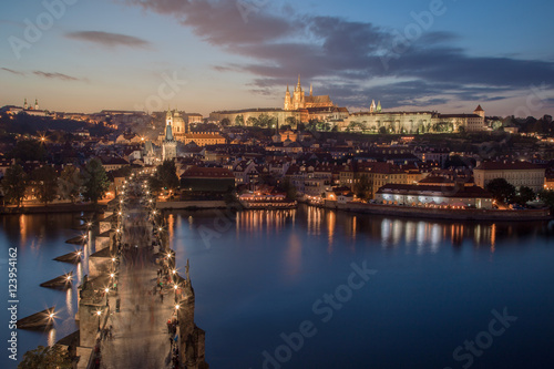 Panorama of Prague with red roofs from above autumnal day at sunset, Czech Republic.