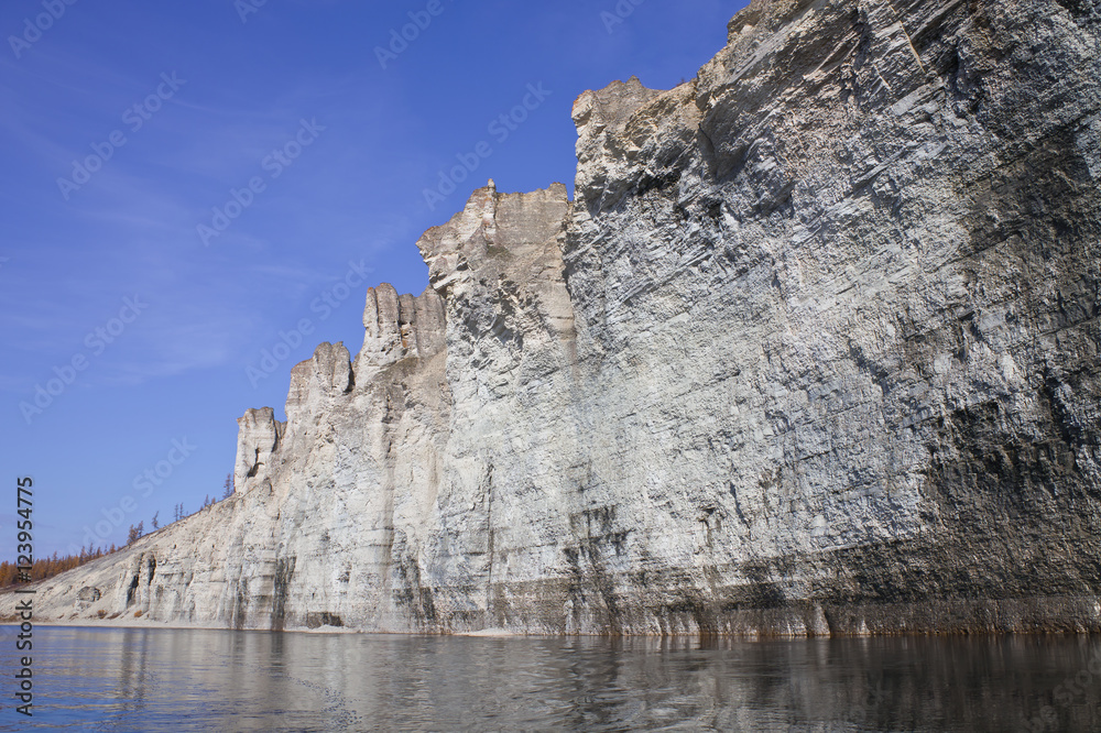 The rocky shores of the Siberian taiga river