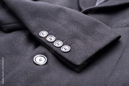 special buttons on the black coat