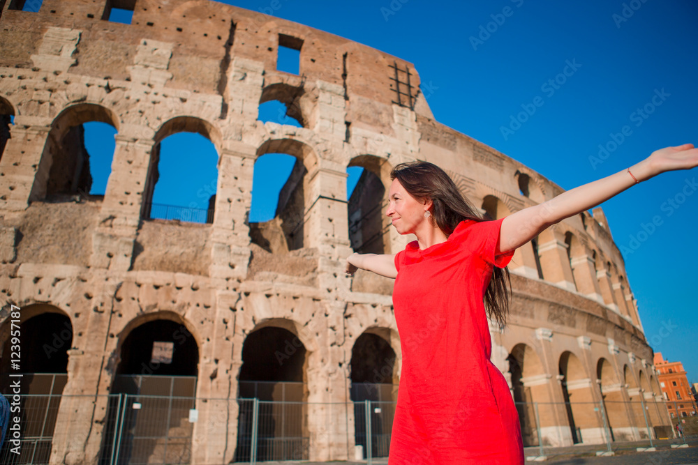 Young woman in front of Colosseum in Rome, Italy. Girl in Europe vacation