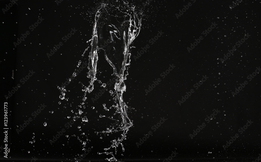 Water splash with air bubbles. Close up. Black background