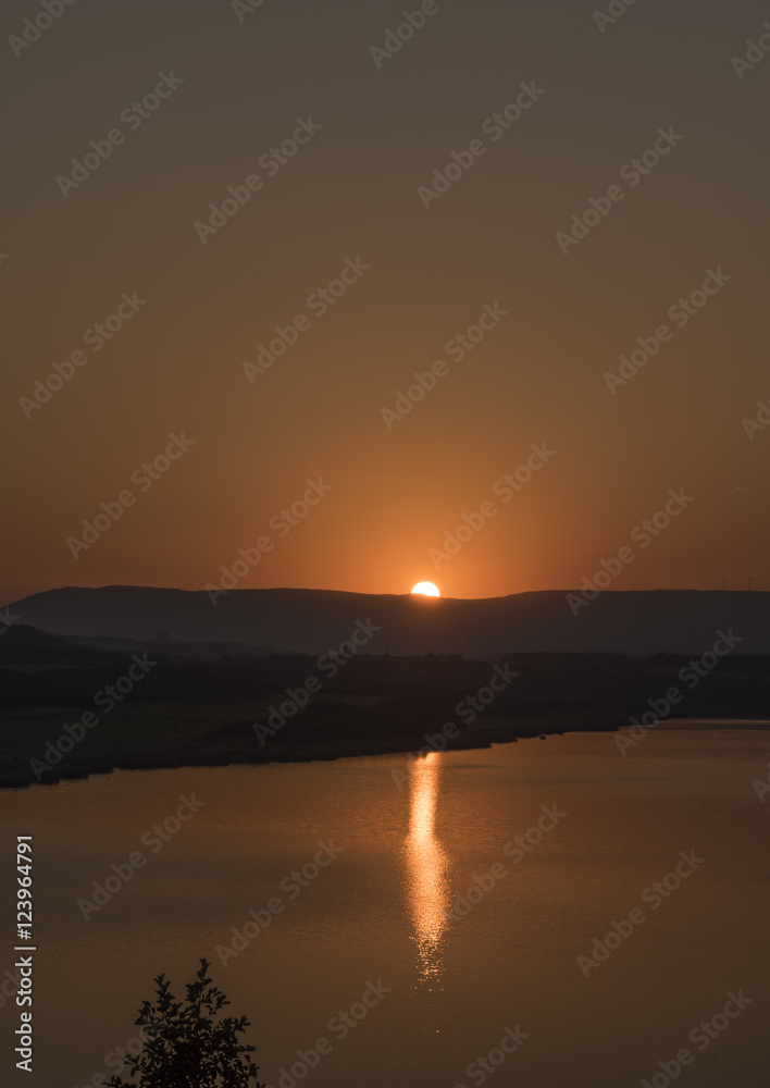 Sunset near Milada lake in summer evening