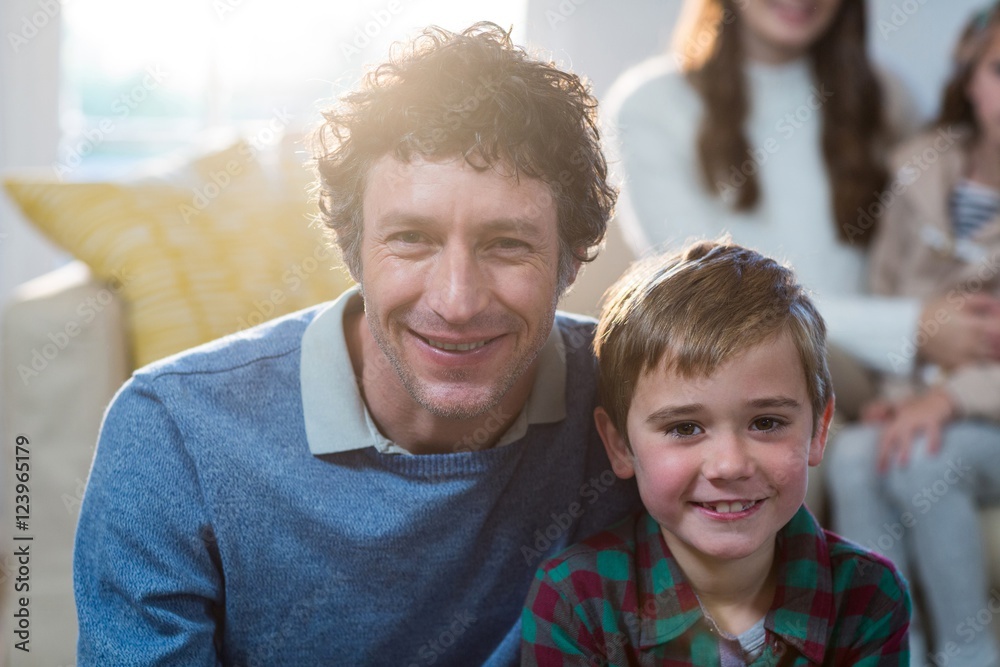 Portrait of father and son smiling Portrait of father and son smiling