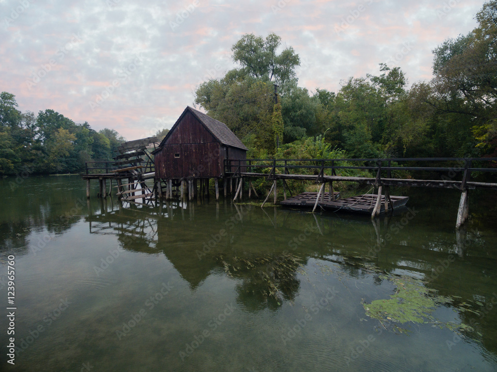 Old watermill on Small Danube near the village Tomasikovo, Slovakia at dusk Old watermill on Small Danube near the village Tomasikovo, Slovakia at dusk